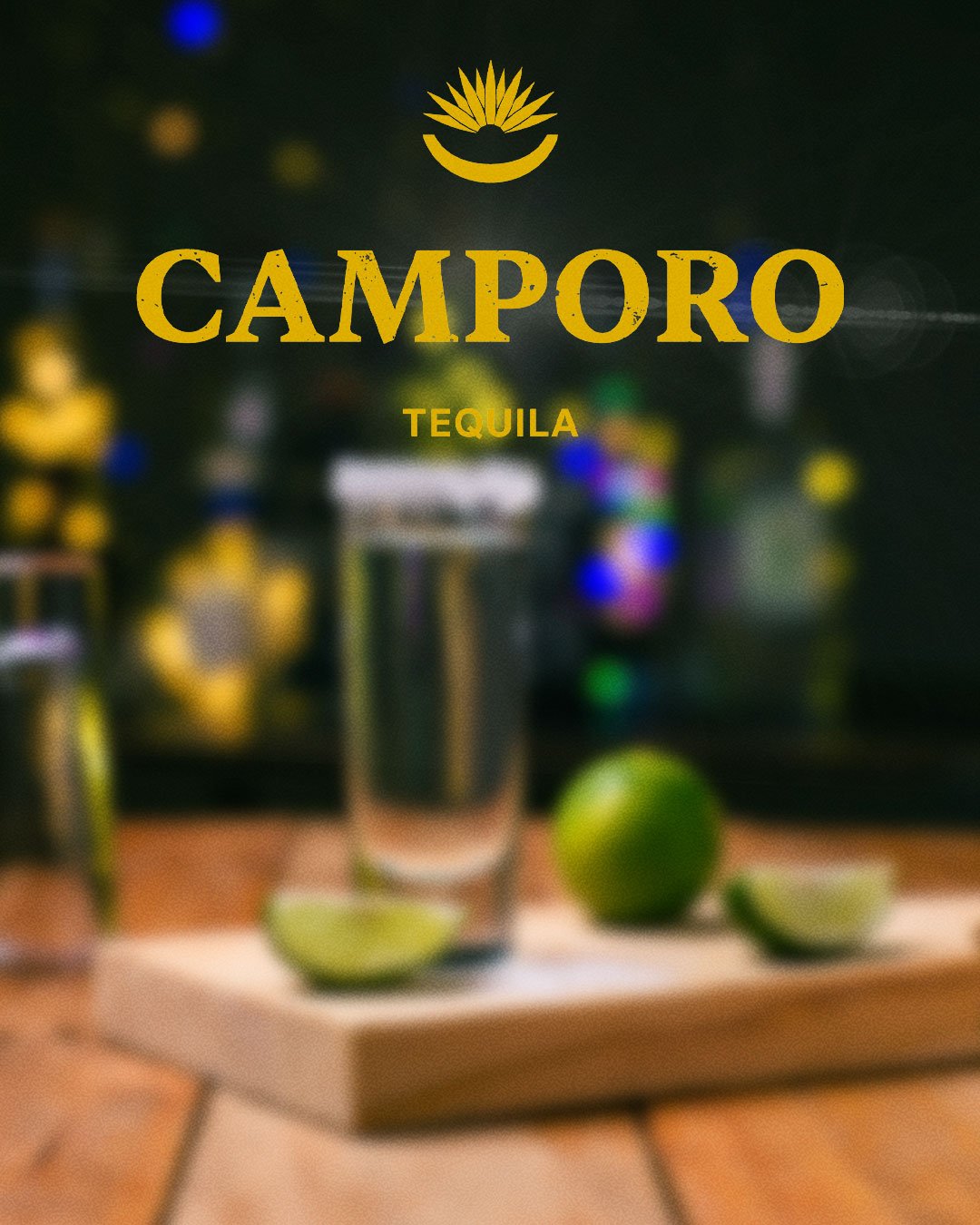 Glass of Camporo Tequila with limes, representing our heritage.